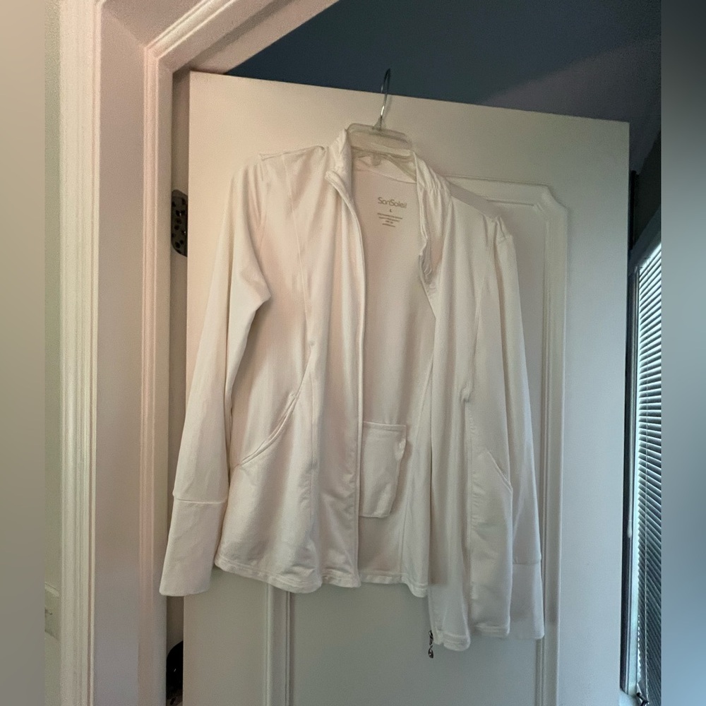 Unprotective white zip up